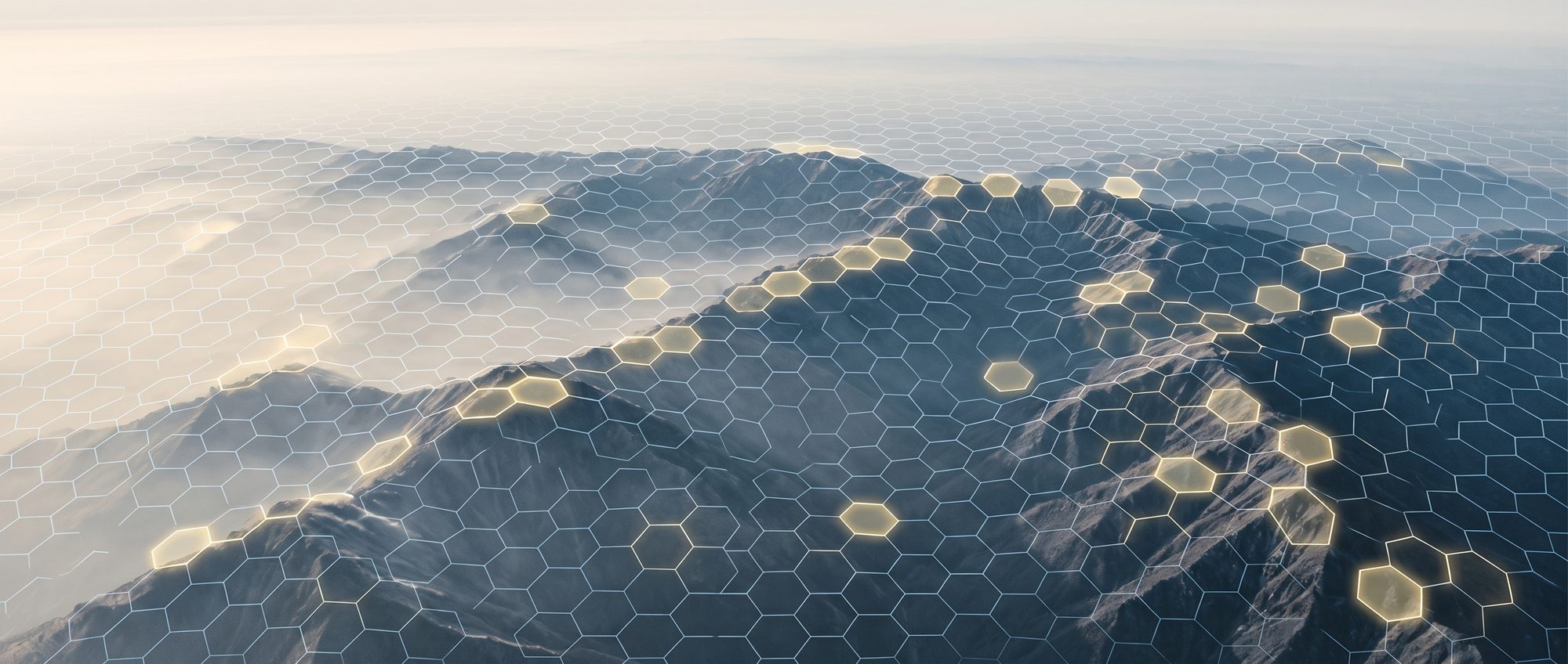 Misty mountains covered by a glowing hexagon grid with a few cells lit gold
